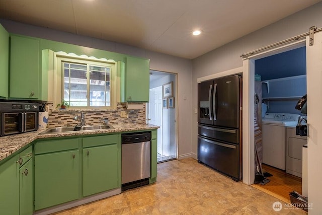 1427 E 3rd St, Port Angeles, WA 98362 - kitchen featuring washer and dryer, stainless steel dishwasher, fridge with ice dispenser, green cabinetry, and recessed lighting