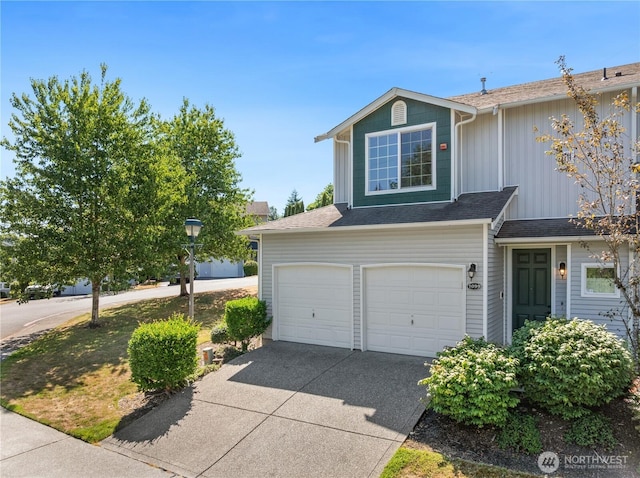 2711 SE 10th St Unit 1099, Renton, WA 98058 - traditional-style house featuring driveway, board and batten siding, an attached garage, and roof with shingles