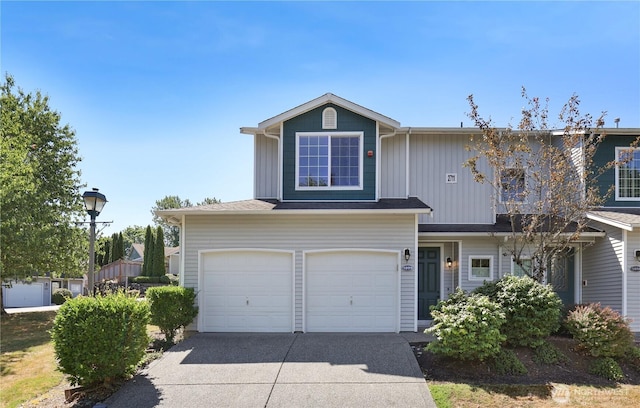 2711 SE 10th St Unit 1099, Renton, WA 98058 - traditional home with concrete driveway, an attached garage, and board and batten siding