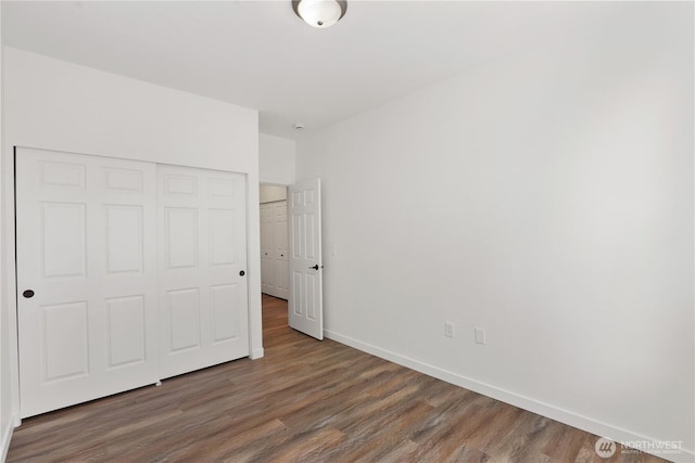 2711 SE 10th St Unit 1099, Renton, WA 98058 - unfurnished bedroom featuring wood finished floors and a closet