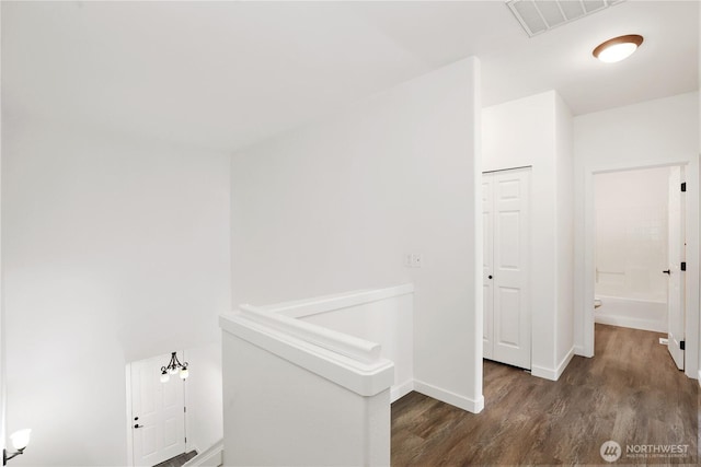 2711 SE 10th St Unit 1099, Renton, WA 98058 - corridor featuring wood finished floors and an upstairs landing