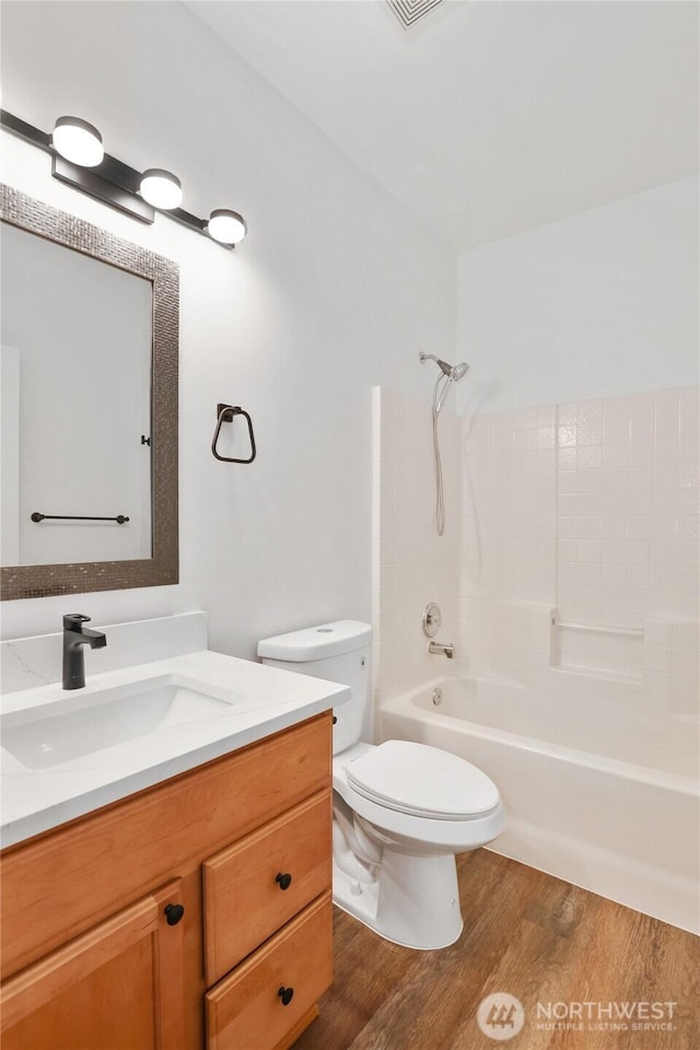 2711 SE 10th St Unit 1099, Renton, WA 98058 - bathroom with vanity, wood finished floors, and washtub / shower combination