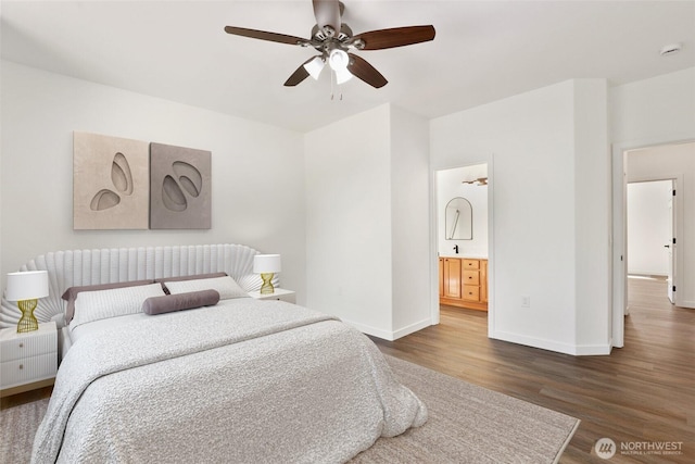 2711 SE 10th St Unit 1099, Renton, WA 98058 - bedroom with dark wood-style flooring, connected bathroom, and ceiling fan