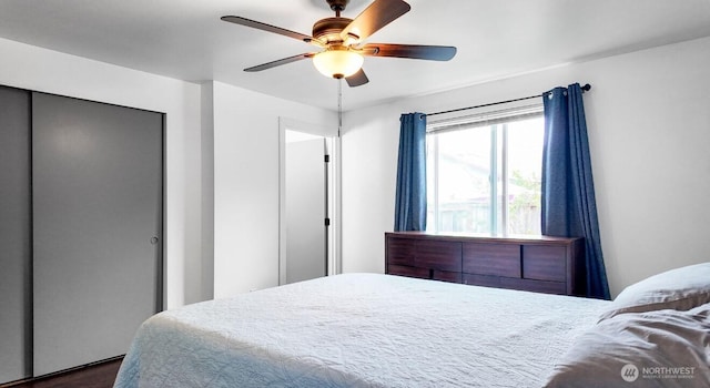 16228 Curry Ct SE, Yelm, WA 98597 - bedroom featuring a closet, dark wood-style flooring, and ceiling fan
