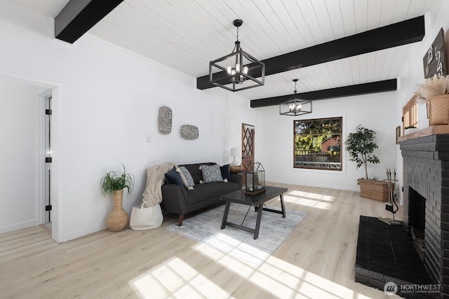 4020 N 34th St, Tacoma, WA 98407 - living area featuring a chandelier, wood finished floors, a fireplace, and a wood ceiling with exposed beams