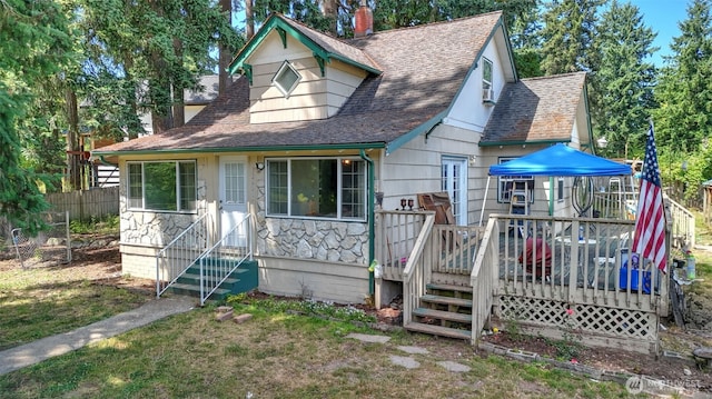 32626 46th Pl S, Auburn, WA 98001 - view of front of home featuring a shingled roof, a wooden deck, and stone siding