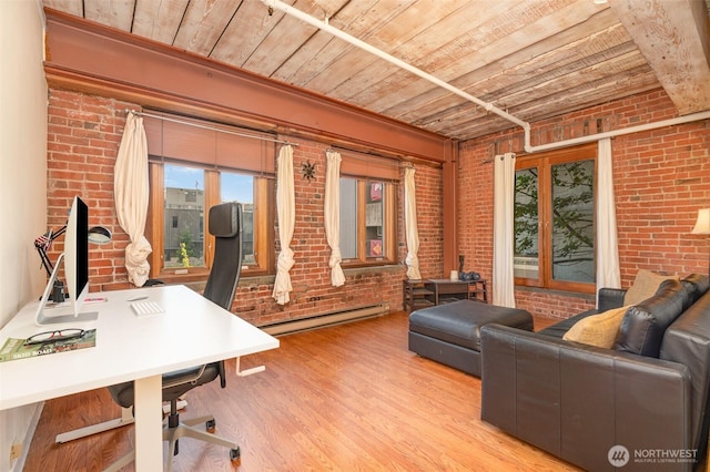1507 Western Ave Unit R203, Seattle, WA 98101 - home office with baseboard heating, wooden ceiling, brick wall, plenty of natural light, and wood finished floors