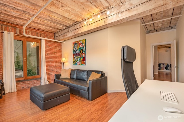 1507 Western Ave Unit R203, Seattle, WA 98101 - living room featuring track lighting, brick wall, wood finished floors, and wood ceiling