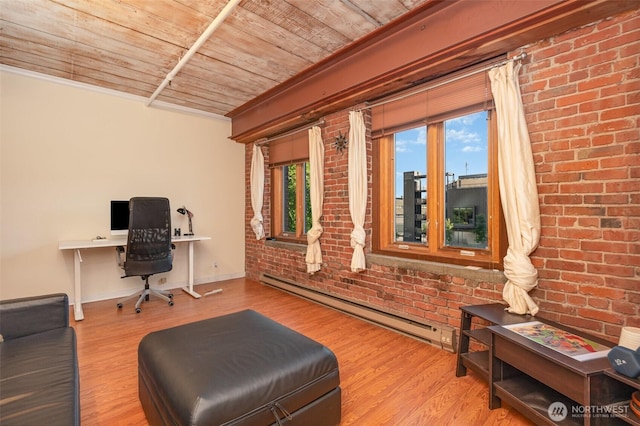 1507 Western Ave Unit R203, Seattle, WA 98101 - home office with a baseboard radiator, wooden ceiling, wood finished floors, and brick wall