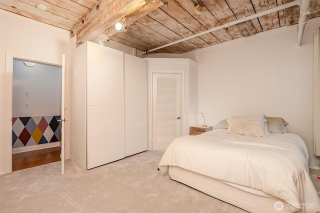 1507 Western Ave Unit R203, Seattle, WA 98101 - bedroom featuring wood ceiling and light colored carpet