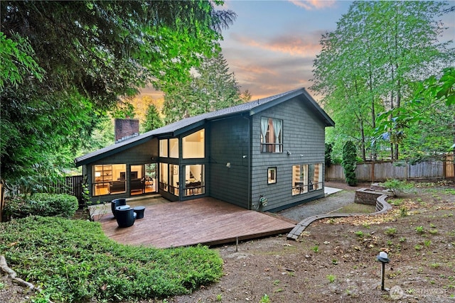 2109 130th Pl SE, Bellevue, WA 98005 - rear view of house with a wooden deck and a chimney