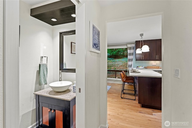 2109 130th Pl SE, Bellevue, WA 98005 - bathroom with vanity, wood finished floors, and decorative backsplash