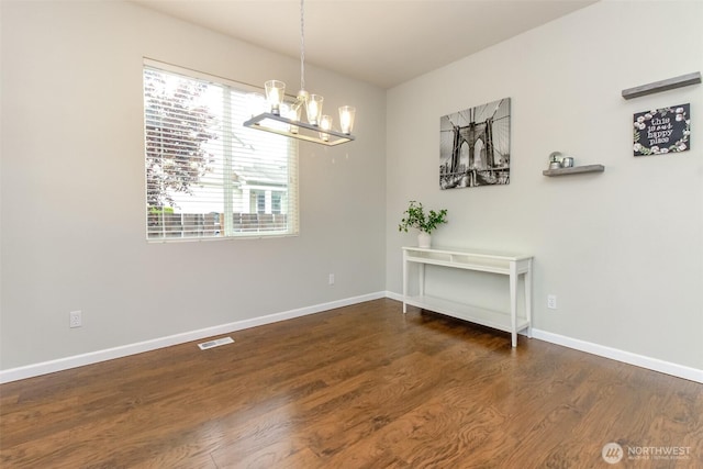 6409 Francis Ave SE, Auburn, WA 98092 - dining room with a chandelier and wood finished floors