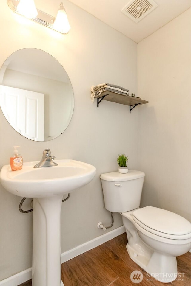 6409 Francis Ave SE, Auburn, WA 98092 - bathroom featuring toilet and wood finished floors