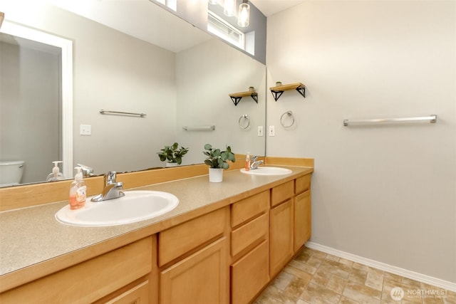 6409 Francis Ave SE, Auburn, WA 98092 - bathroom featuring double vanity and stone finish flooring