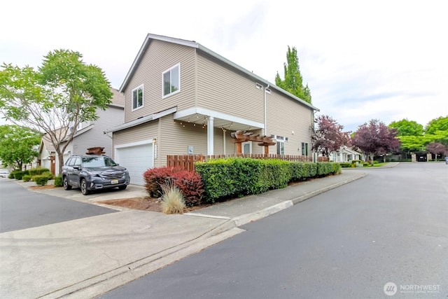 6409 Francis Ave SE, Auburn, WA 98092 - view of side of property featuring an attached garage and driveway