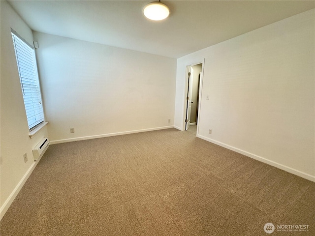 1626 Grant Ave S Unit E202, Renton, WA 98055 - spare room featuring carpet flooring and baseboards