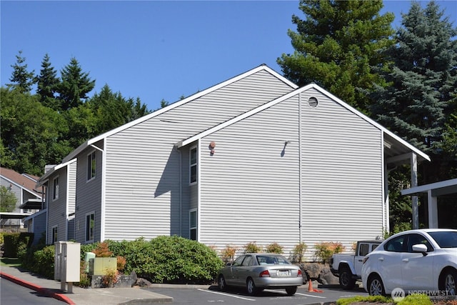 1626 Grant Ave S Unit E202, Renton, WA 98055 - view of side of home featuring uncovered parking