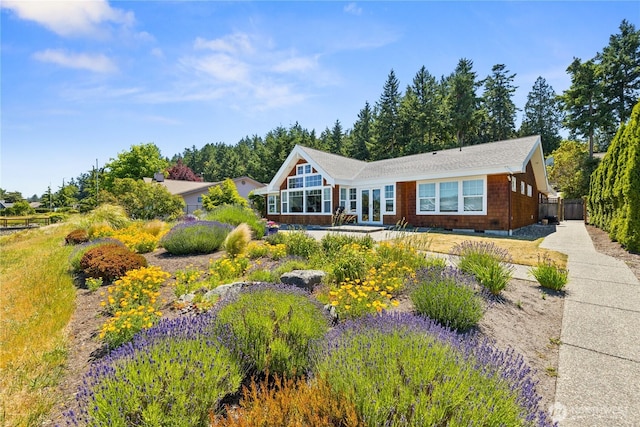 882 Shoshone Dr, La Conner, WA 98257 - view of front of house featuring french doors and a patio