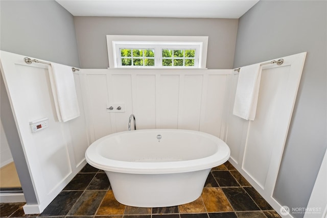 882 Shoshone Dr, La Conner, WA 98257 - full bathroom with a freestanding tub and stone tile flooring
