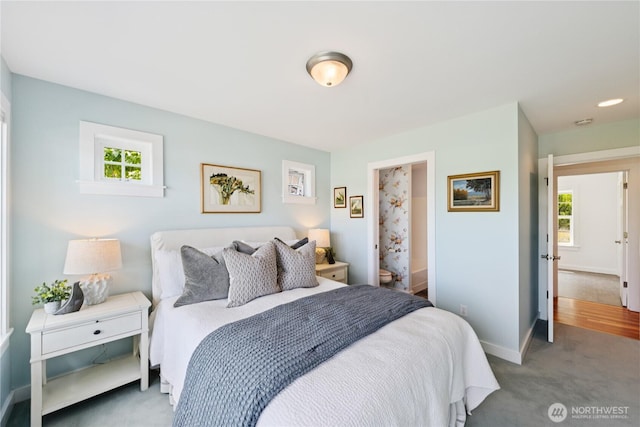 882 Shoshone Dr, La Conner, WA 98257 - bedroom featuring multiple windows, carpet flooring, and ensuite bath