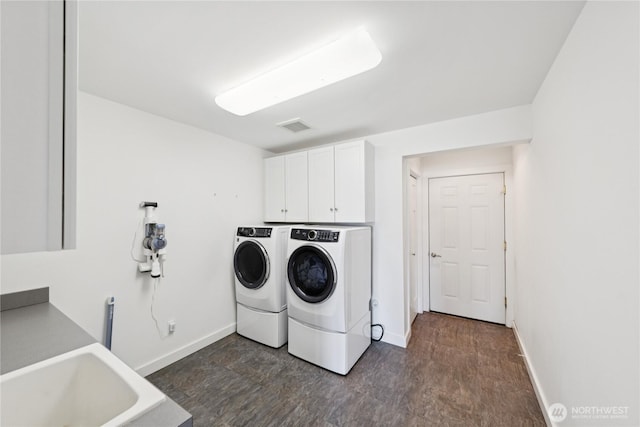 882 Shoshone Dr, La Conner, WA 98257 - laundry area featuring separate washer and dryer and cabinet space