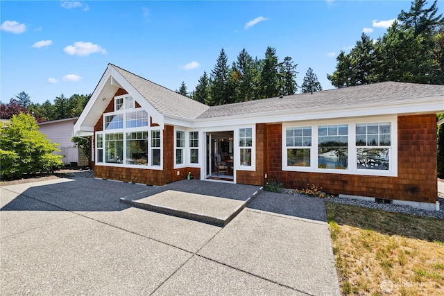 882 Shoshone Dr, La Conner, WA 98257 - view of front of home featuring a patio and roof with shingles