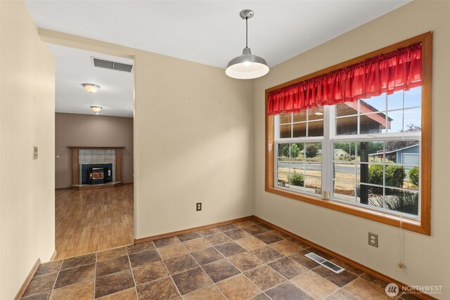 105 Clearview Cir, Chehalis, WA 98532 - unfurnished dining area featuring dark stone finish floors and a tile fireplace