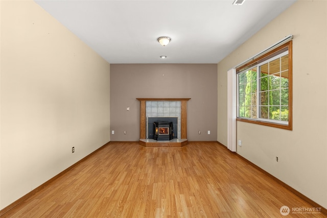 105 Clearview Cir, Chehalis, WA 98532 - unfurnished living room with light wood-type flooring and a tiled fireplace