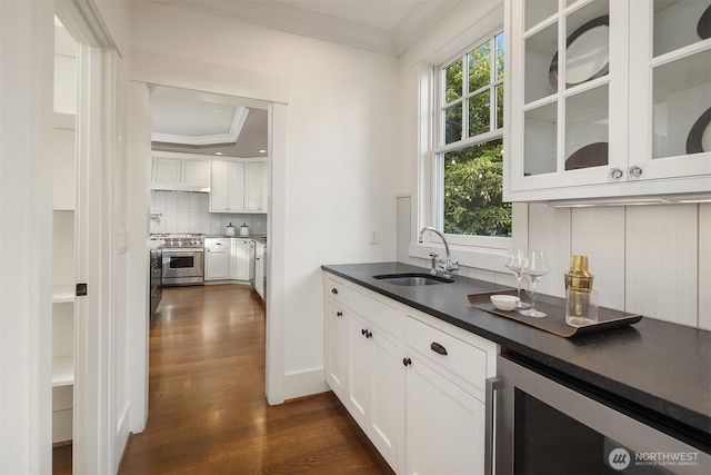 3202 Hunter Blvd S, Seattle, WA 98144 - kitchen featuring high end range, crown molding, wine cooler, dark wood finished floors, and dark countertops