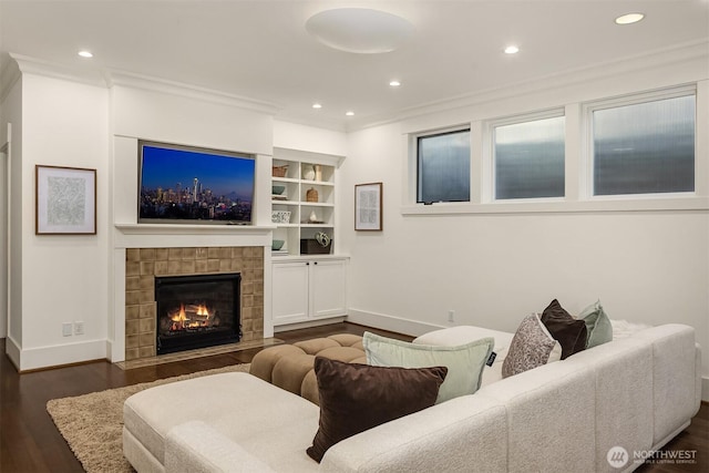 3202 Hunter Blvd S, Seattle, WA 98144 - living room with dark wood finished floors, a fireplace, recessed lighting, ornamental molding, and built in shelves