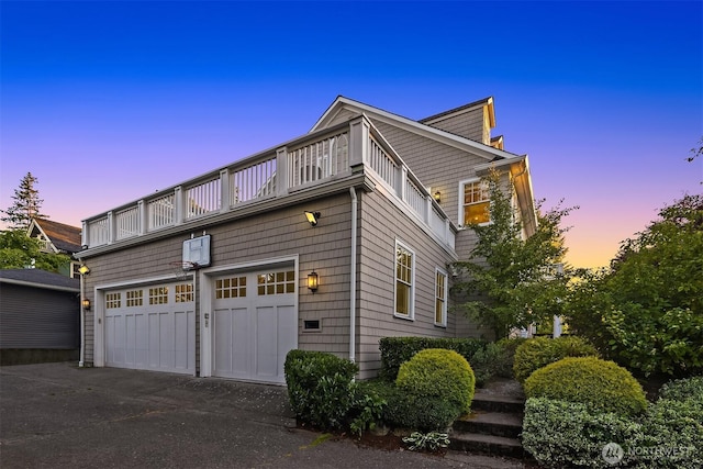 3202 Hunter Blvd S, Seattle, WA 98144 - property exterior at dusk with a balcony and a garage
