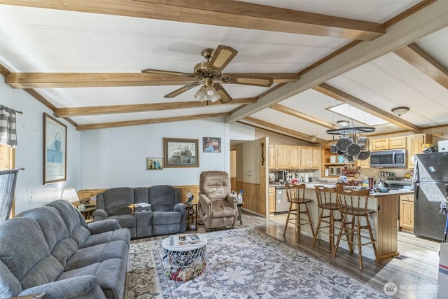 451 Serpentine Ave, Sequim, WA 98382 - living room with light wood finished floors, a ceiling fan, and a wainscoted wall