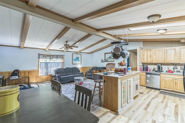 451 Serpentine Ave, Sequim, WA 98382 - kitchen featuring dishwasher, light brown cabinets, wooden walls, a wainscoted wall, and light wood-type flooring