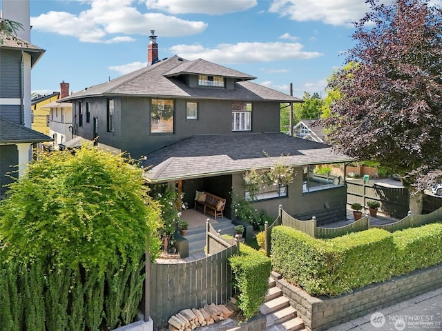 2233 2nd Ave W, Seattle, WA 98119 - american foursquare style home featuring roof with shingles, a chimney, and stucco siding