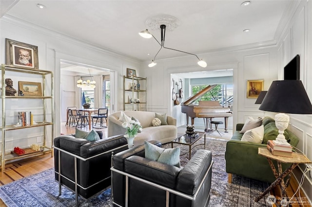2233 2nd Ave W, Seattle, WA 98119 - living room featuring a decorative wall, ornamental molding, a chandelier, and wood finished floors