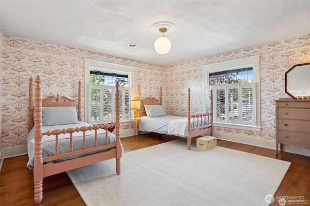 2233 2nd Ave W, Seattle, WA 98119 - bedroom featuring wallpapered walls and wood finished floors