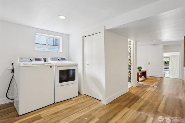 2233 2nd Ave W, Seattle, WA 98119 - laundry area featuring light wood-type flooring, independent washer and dryer, and recessed lighting