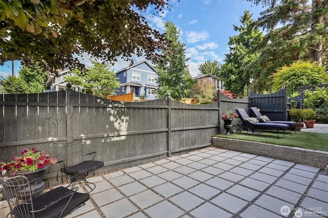 2233 2nd Ave W, Seattle, WA 98119 - fenced backyard featuring a patio area