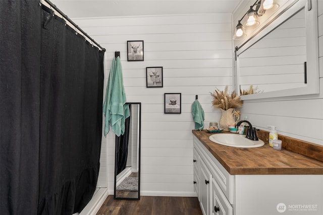 174 Skinner Rd, Chehalis, WA 98532 - bathroom with vanity, wood finished floors, a stall shower, and wood walls