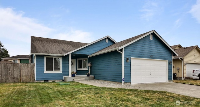 16223 Birkland St SE, Yelm, WA 98597 - view of front facade featuring a garage, driveway, and a shingled roof