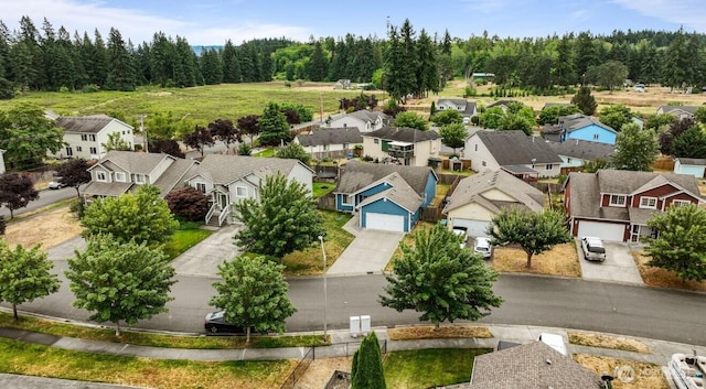 16223 Birkland St SE, Yelm, WA 98597 - aerial perspective of suburban area with a heavily wooded area