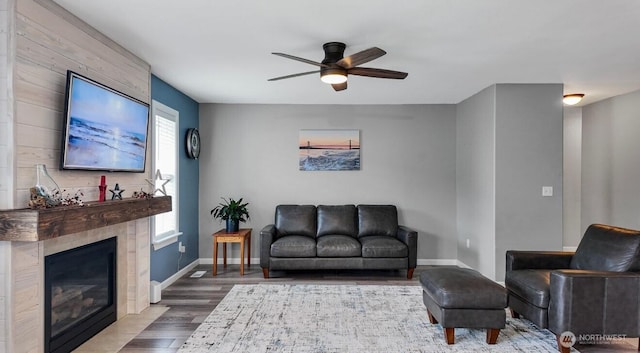16223 Birkland St SE, Yelm, WA 98597 - living area with wood finished floors, ceiling fan, and a tile fireplace