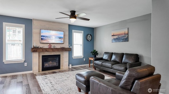 16223 Birkland St SE, Yelm, WA 98597 - living area featuring ceiling fan, wood finished floors, and a tile fireplace
