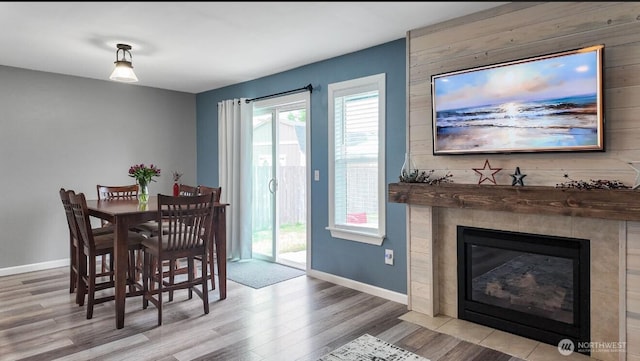 16223 Birkland St SE, Yelm, WA 98597 - dining space with wood finished floors and a tile fireplace