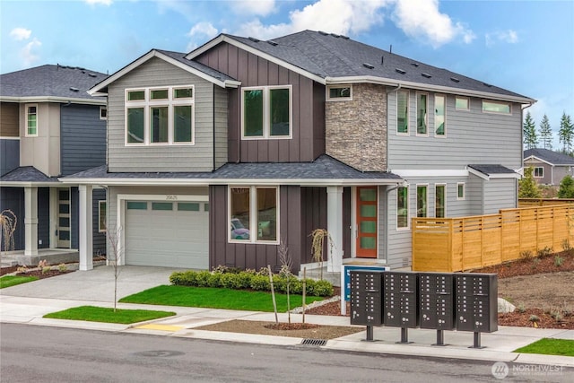 20625 153rd St E, Bonney Lake, WA 98391 - view of front of house featuring board and batten siding, a garage, concrete driveway, and a shingled roof