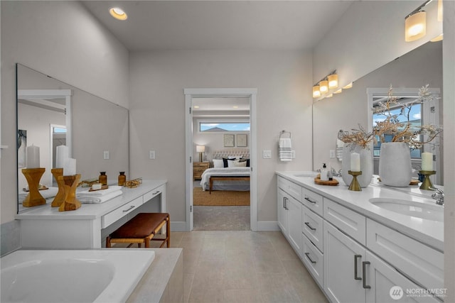 20625 153rd St E, Bonney Lake, WA 98391 - bathroom with double vanity, ensuite bath, a tub to relax in, and recessed lighting