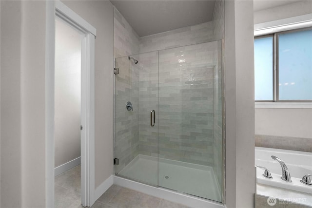 20625 153rd St E, Bonney Lake, WA 98391 - full bathroom featuring tile patterned floors, a stall shower, and a bath