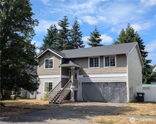 15730 91st Way SE, Yelm, WA 98597 - raised ranch featuring an attached garage and asphalt driveway