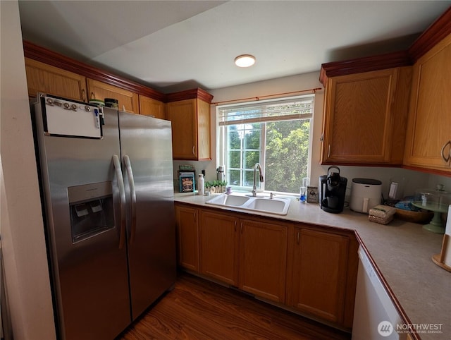 15730 91st Way SE, Yelm, WA 98597 - kitchen with stainless steel fridge, light countertops, brown cabinetry, and dark wood-style floors